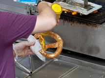 Pretzel Vendor Cart in New York City, pretzels with mustard.