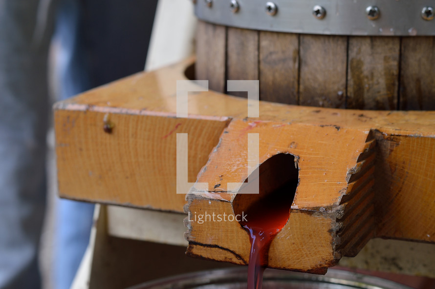 wine pouring from a wine barrel 