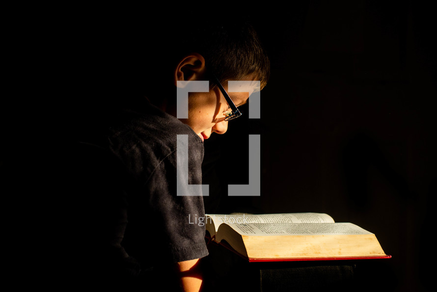 child reading a Bible 