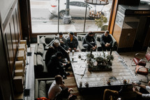 a meeting around a table with coffee 