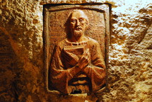A terra cotta (oven-fired clay) plaque showing St. Jerome, the translator of the Latin translation of the Bible (the Vulgate) and the patron saint of Biblical scholars and translators. This plaque is found in the crypt of St. Jerome, under the Church of the Nativity in Bethlehem, where Jerome spent much of his life.