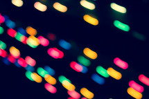 colorful bokeh lights against black 