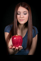 young woman holding an apple 
