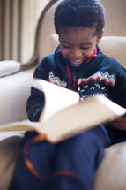 boy child reading a Bible 