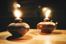 oil lamps on an old wooden table in church
