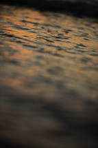 ripples in sea water at sunset 