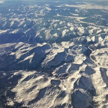aerial view of snow covered mountain peaks