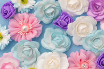 Bed of white and blue Flowers flay layer background