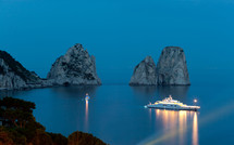 Faraglioni, famous giant rocks, Capri island at night 