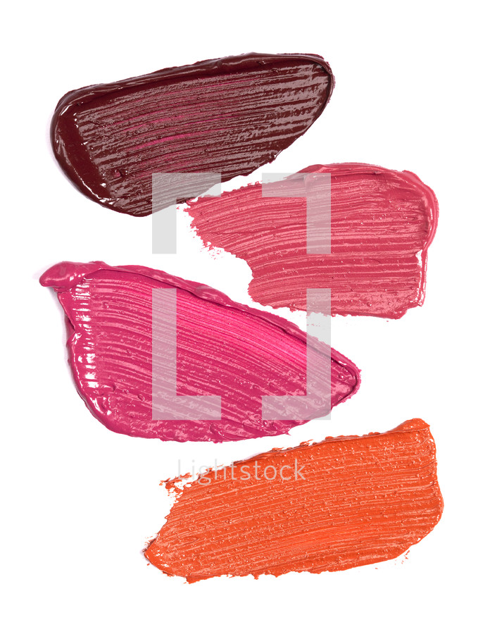 Abstract background - Four Shades of Lipstick and Lip Gloss Swatches Isolated on a White Background