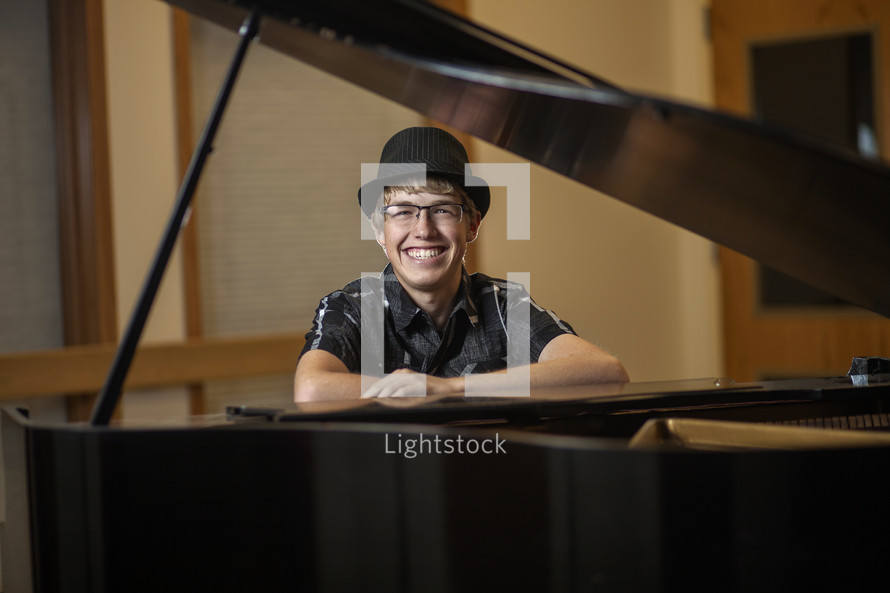 young man and a grand piano 