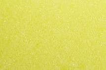 close-up of yellow sponge surface as texture background