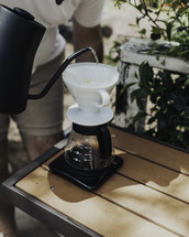 a man making pour over coffee 