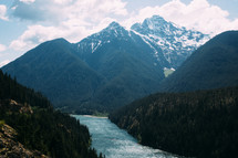 snow capped mountain peaks and river 