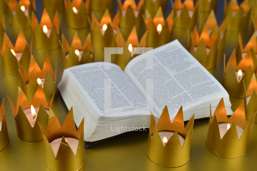opened Bible and crown votives 