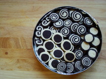 black and white christmas biscuits in a tin

