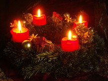 Advent candle wreath with four burning candles