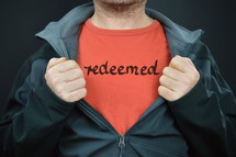 a man with the word redeemed on his t-shirt 