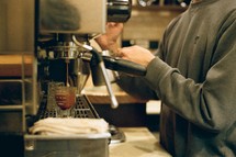 barista brewing espresso 