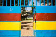 red, yellow, and blue wall and gate door 