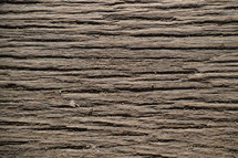 old withered wood planks. 
wood, background, texture, old, withered, plank, planked, planks, planking, rough, raw, bleak, brown, grain, vein, plankwise, ancient, aged, grooves, rills, rutted, furrows