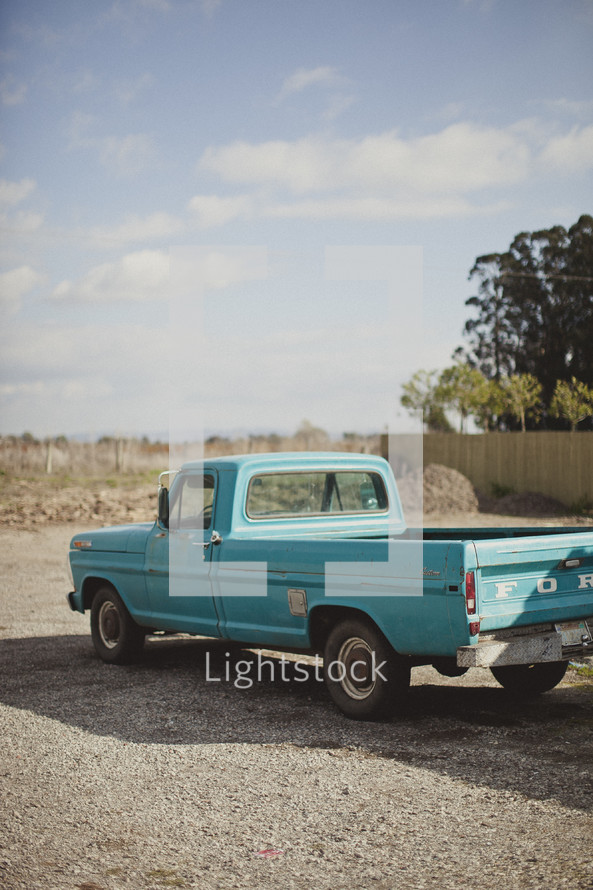 Old truck parked on gravel
