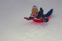 child sledding 