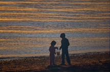 kids on a beach at sunset 