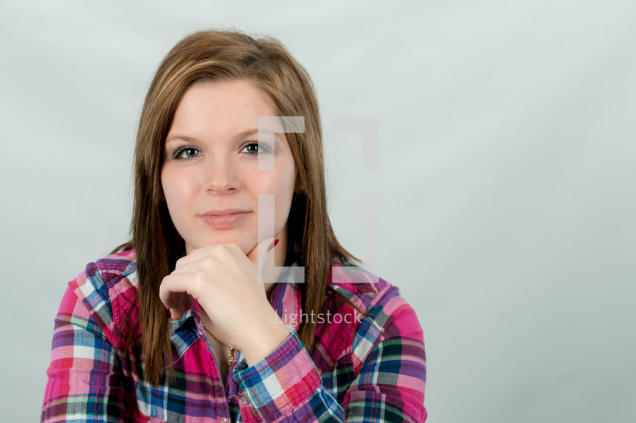 portrait of a young woman in a plaid shirt 