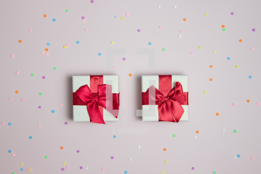 Two small presents on confetti background