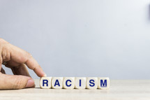 removing a word - racism 