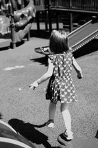 a girl child running to a playground 