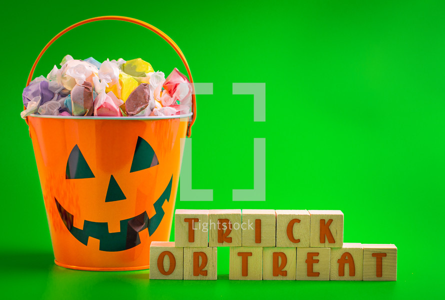 Trick or Treat Sign with a Bucket of Candy