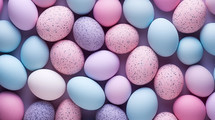 Colorful spotted pastel Easter eggs background texture.