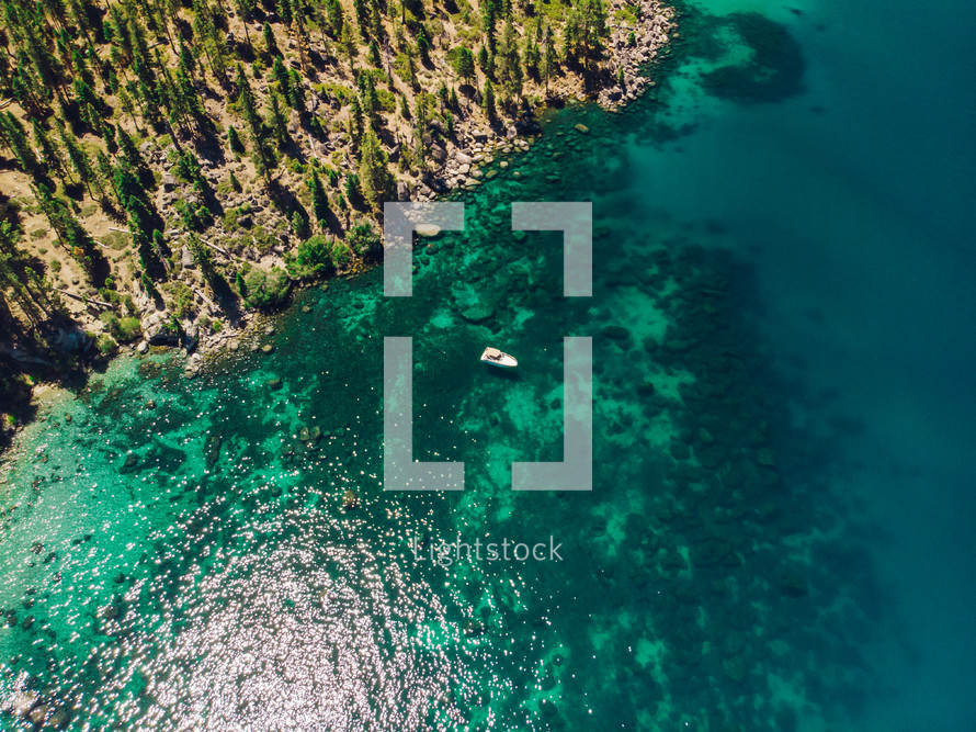 aerial view over clear turquoise waters 