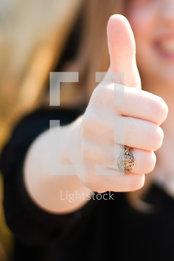 woman with thumbs up 