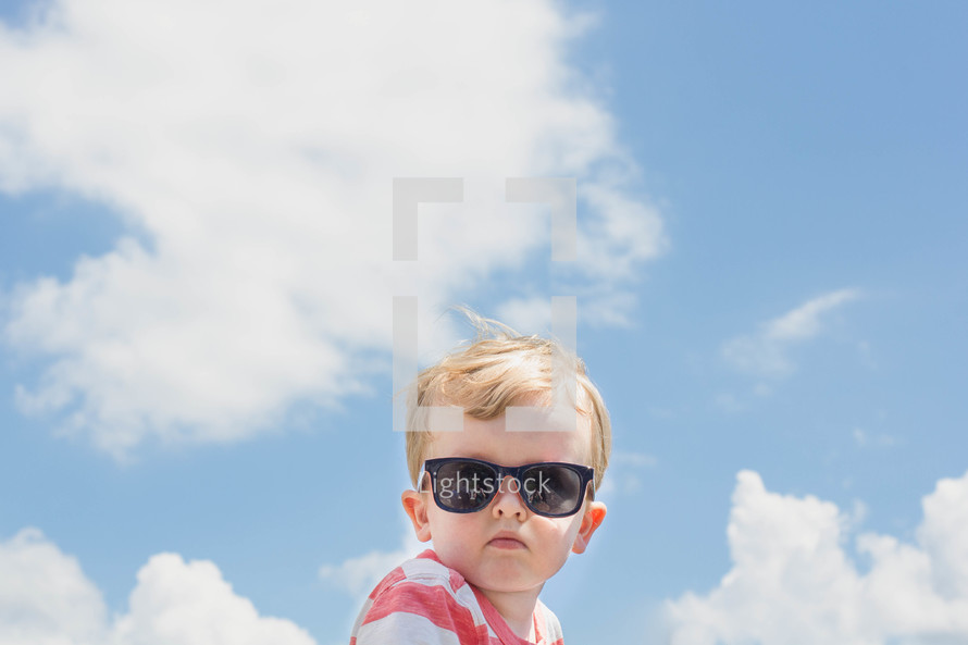 toddler boy wearing sunglasses 