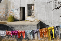 clothes on the line in front of an old building