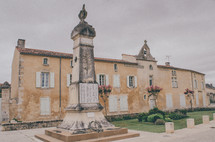 monument in front of an old building in France 