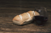 bread loaf and cup of wine 