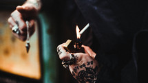 tattooed hands smoking 