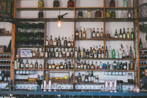 bottles of liquor on the shelves of a bar 