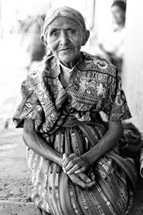 Elderly woman with folded arms