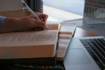 open Bible and laptop computer 
