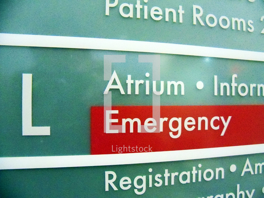 An Emergency Room sign and directory from an area hospital sign directing patients and hospital visitors to the ER where patients are treated for injuries, accidents and sudden illnesses. 