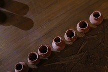 row of clay pottery jars 