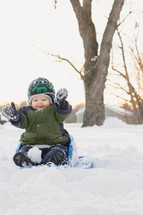 infant boy in the snow 