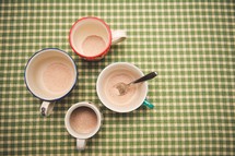spoon in a mug of powered hot cocoa 