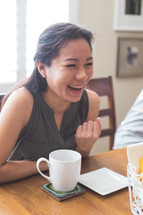 a woman laughing at a Bible study 