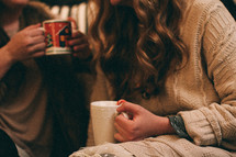 women in conversation while drinking hot cocoa 